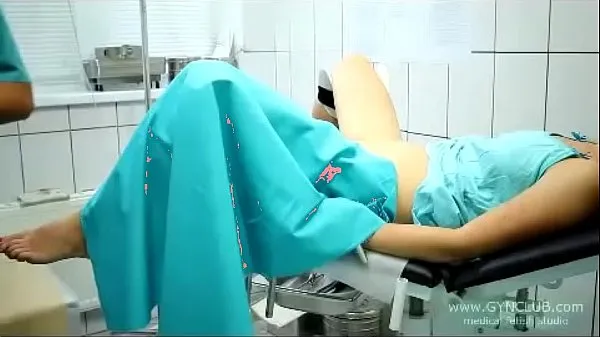 Show beautiful girl on a gynecological chair (33 warm Clips