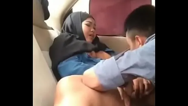 Show Hijab girl in car with boyfriend warm Clips